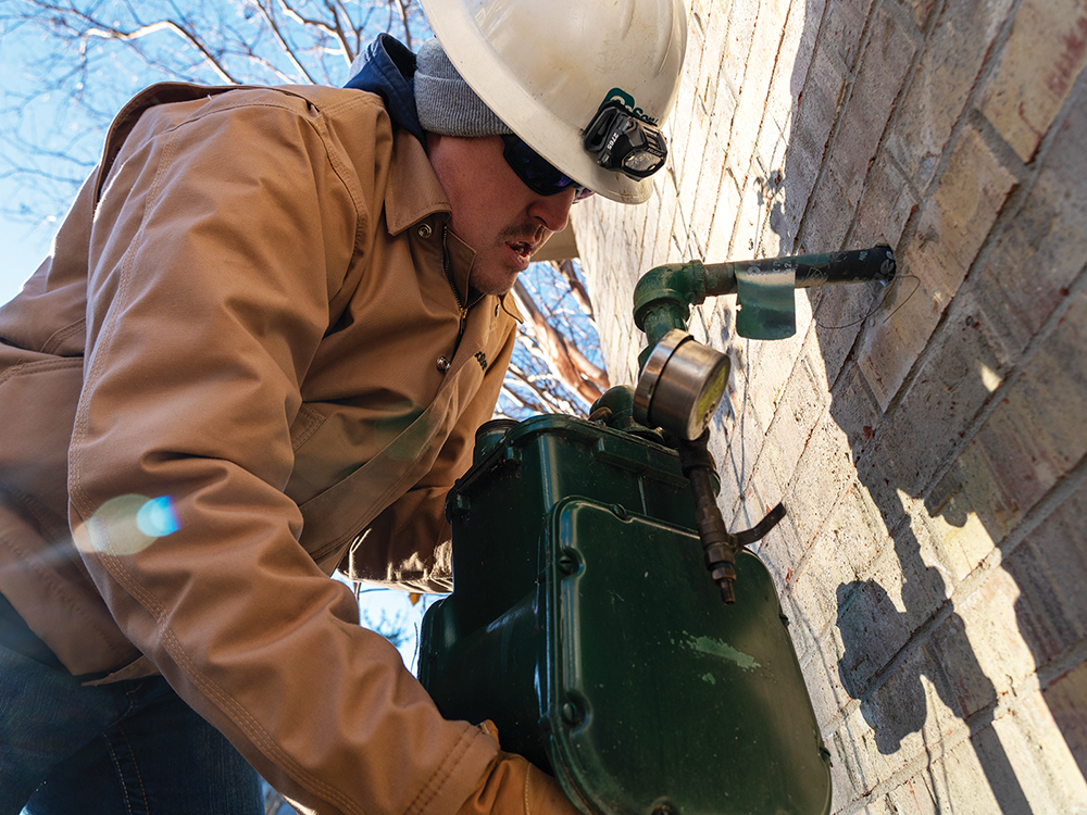 Checking pressure on a residential meter and talking with the homeowner during a new move-in.