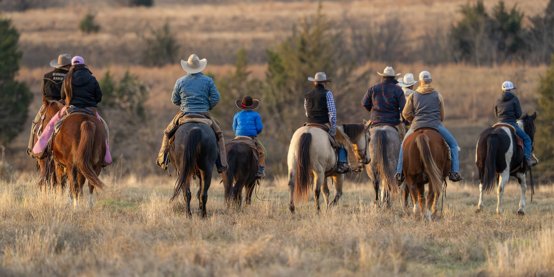 The Schumachers lead family and friends into the pasture for the yearly roundup, gathering cattle and calves the old‑fashioned way. Photo by BRIAN ELLEDGE | CoServ