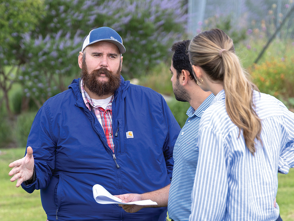 CoServ Design Tech Matt Walker meets with a Member’s engineering representatives to discuss a new development where they need electricity extended to. Photo by KEN OLTMANN | CoServ