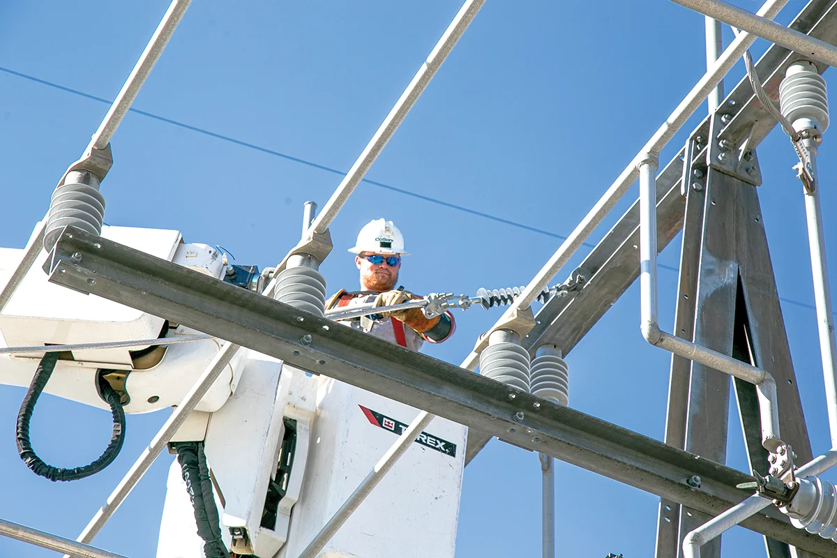 Journeyman Lineman Austin Clayton works at the Aubrey Substation. Photo by NICHOLAS SAKELARIS