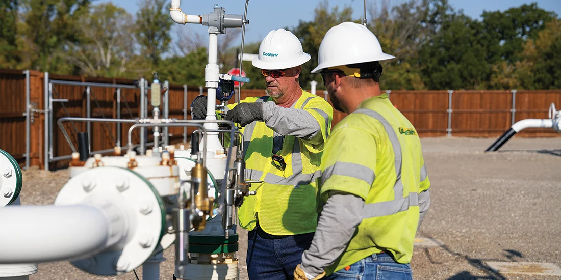 Gas System Operations Technician Jeff Williamson and Gas Critical Infrastructure Supervisor Brock Squier check pressure at the regulator station. Photo by BRIAN ELLEDGE