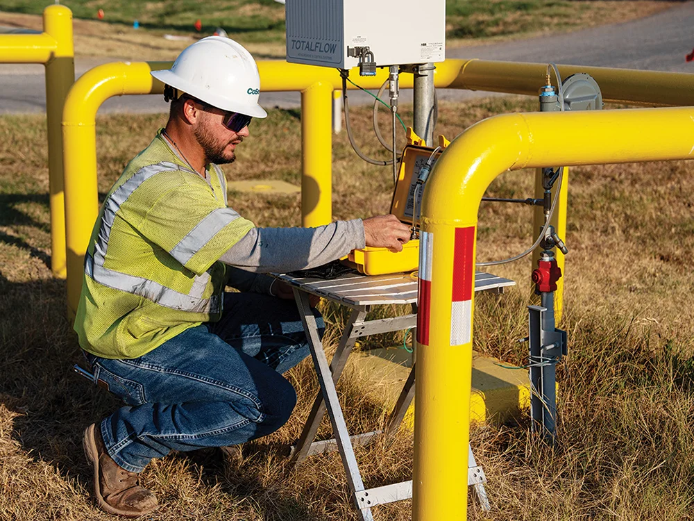 Gas Critical Infrastructure Supervisor Brock Squier uses an Odorant Detection system to check the amount of Mercaptan in CoServ Gas Lines. Photos by BRIAN ELLEDGE