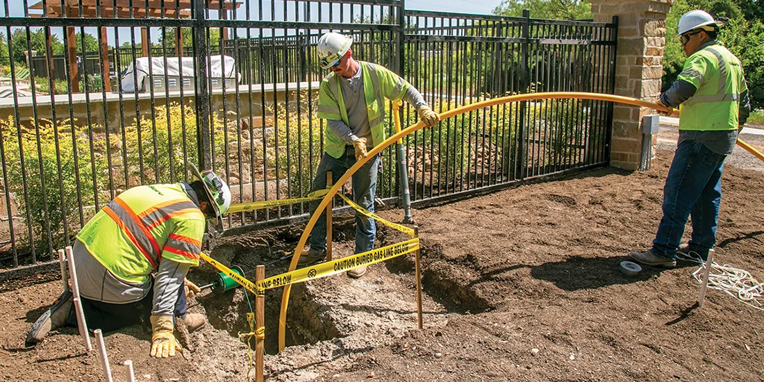 CoServ Gas crews install a 1 1/4 service line to bring gas to a new location in Rowlett. Photo by NICHOLAS SAKELARIS