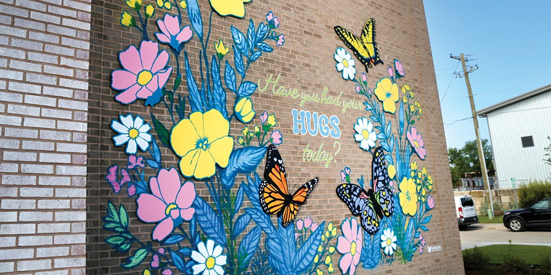 Hugs Cafe Grand Opening on July 2, 2026 in downtown McKinney. The facility features an inspirational mural outside. Photo by NICHOLAS SAKELARIS