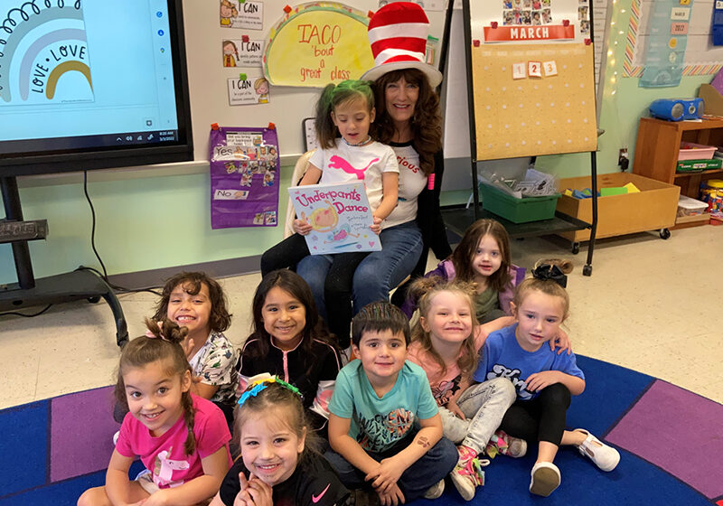 Administrative Assistant Kathy Gray with Mrs.Chisholm's class at the Krum Early Education Center for Read Across America Day. Photo provided by Kathy Gray.